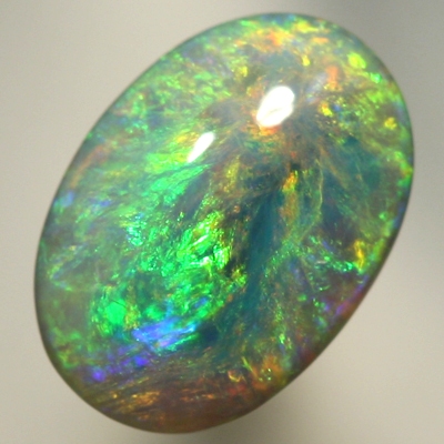SOLID SEMI BLACK OPAL Pretty opal with orange bursting into greens and blues. SEE VIDEO